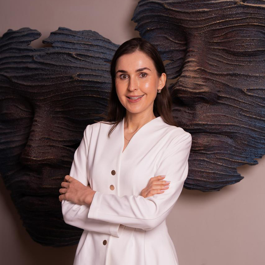 Dr. Tatiana seated in a clinical setting